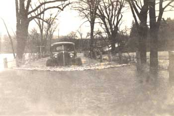 Flood with car, 1936. Woodstock Historical Society photo